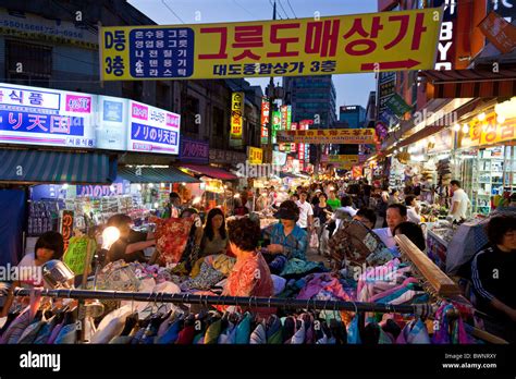 Koreans Shopping At Stall Selling Clothing In Namdaemun Market In Seoul