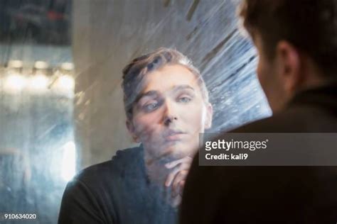 Man Staring In Mirror Photos And Premium High Res Pictures Getty Images