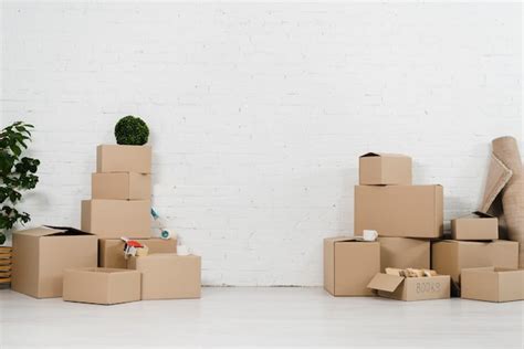 Free Photo Romantic Young Couple Dancing In Front Of Cardboard Boxes