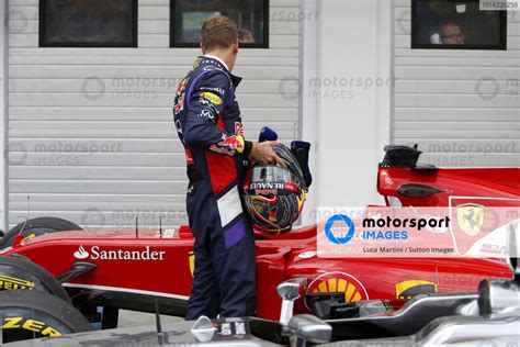 Sebastian Vettel GER Red Bull Racing Looks At The Ferrari F14 T In