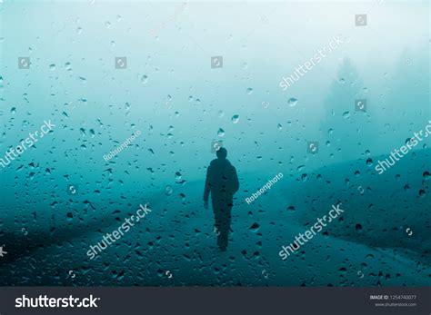 Man walking in the rain Images, Stock Photos & Vectors | Shutterstock