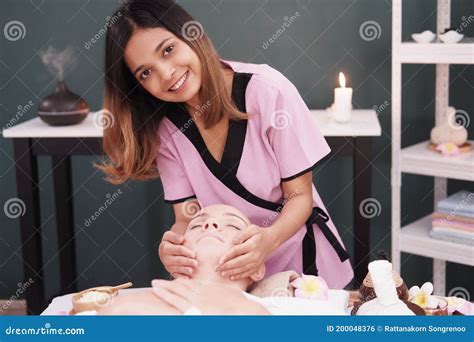 Smiling Professional Asian Thai Massage Therapist Woman Is Making