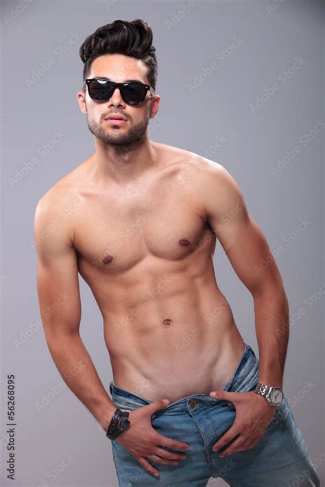 Topless Man Pulling Down His Pants Stock Photo Adobe Stock