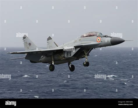 An Indian Navy Mig 29k Fulcrum Flies Over The Aircraft Carrier Uss