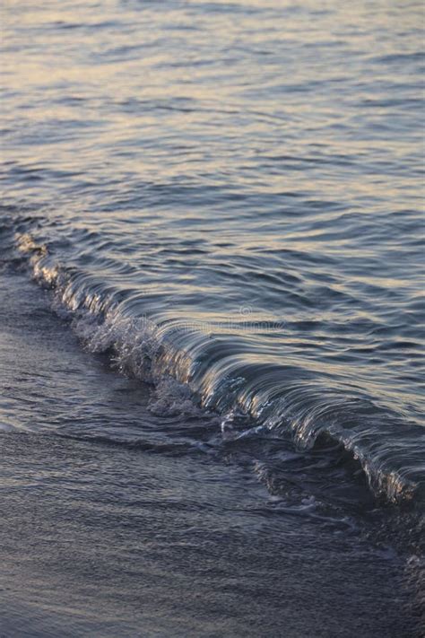 Powerful Wave of Seawater Surging Onto the Sandy Beach Stock Photo ...