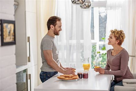 Cheerful Husband And Wife Relaxing In Kitchen Stock Image Image Of