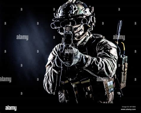 Army Soldier Aiming Rifle In Camera In Darkness Stock Photo Alamy