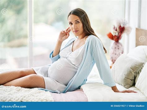 Portrait Of Young Beautiful Pregnant Woman Posing At Home Siiting In Bed Stock Image Image Of