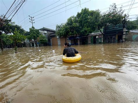 Residents Use Floaties To Commute Through Waist High Flooding In