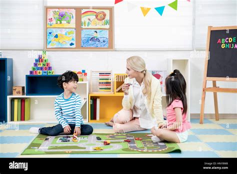 Kindergarten Children With Foreign Teacher Stock Photo Alamy