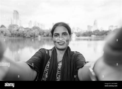 Happy Mature Beautiful Indian Woman Taking Selfie At The Park Stock Photo Alamy
