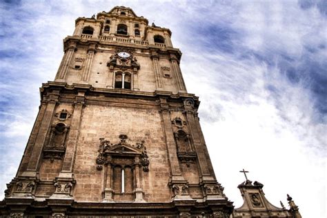 Tower Bell Clock And Carved Stone Details Of The Cathedral Of Murcia