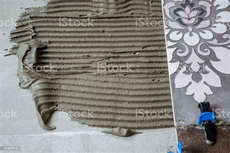 Fresh Glue For Gluing Ceramic Tiles Stock Photo - Download Image Now - Built Structure, Cement ...