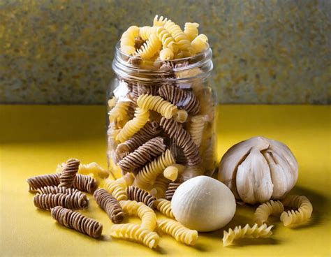 Premium Photo Raw Whole Grain Fusilli Pasta And Gnocci Pasta Uncooked