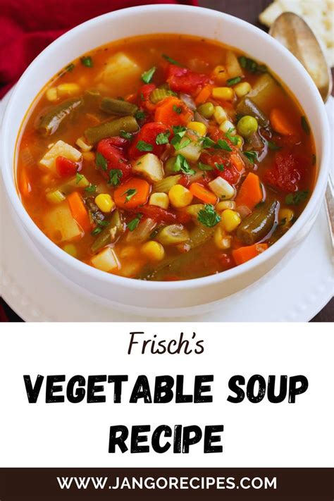 A White Bowl Filled With Vegetable Soup On Top Of A Table