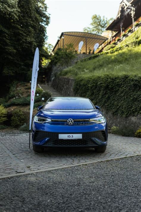 Vertical Shot Of A Blue Electric Volkswagen Car At An Event In Arad