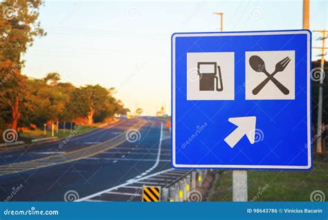 Road Sign at the Roadside Signaling a Gas Station and Food Services on Highway Stock Photo ...