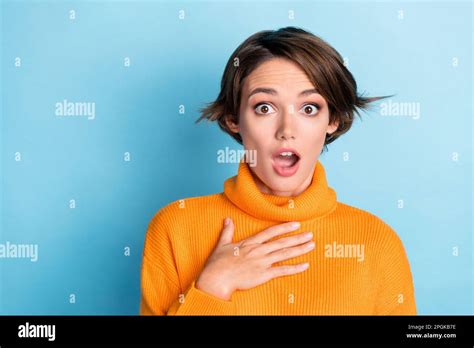 Photo Of Shocked Speechless Girl Open Mouth Cant Believe Arm Touch Chest Isolated On Blue Color