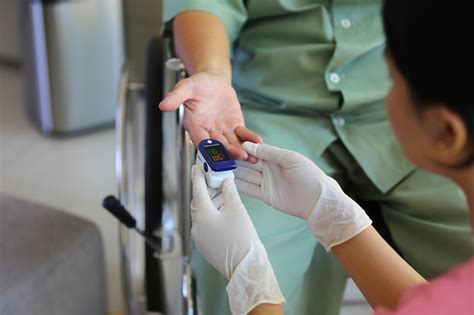 Premium Photo Midsection Of Doctor Examining Patient In Clinic