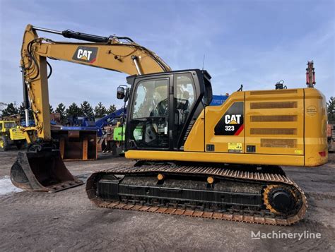 Caterpillar 323 07A NG tracked excavator for sale Poland Nakło n