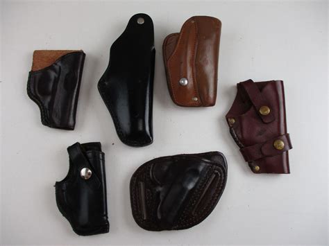 ASSORTED LEATHER SEMI-AUTO STYLE HOLSTERS - Switzer's Auction & Appraisal Service