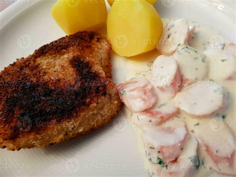 breaded wiener schnitzel with side dishes 24056141 Stock Photo at Vecteezy