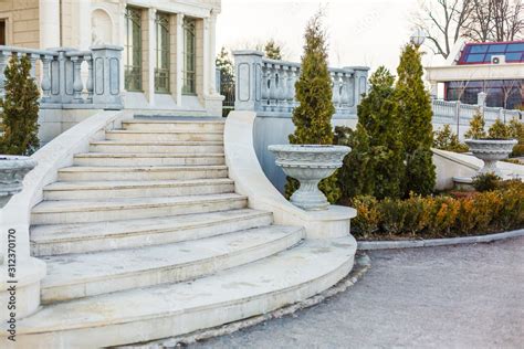 Luxury mansion with marble staircase, white stone balustrade and park ...