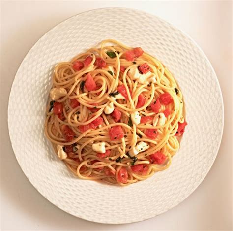 Spaghetti With Fresh Tomatoes Herbs And Mozzarella From The Classic Pasta Cookbook By Giuliano