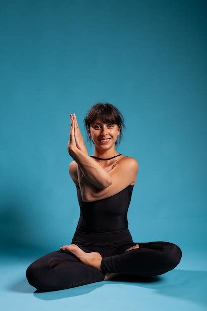 Premium Photo Portrait Of Smiling Zen Woman Trainer Standing In Lotus