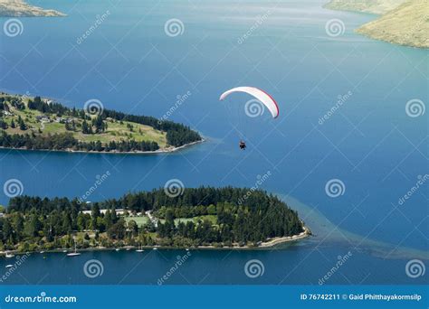 Tandem Paragliding Over Lake Wakatipu In Queenstown New Zealand Stock