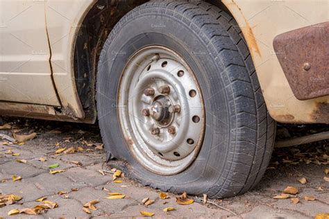 Deflated Damaged Tyre On Car Wheel Containing Tire Flat And Tyre