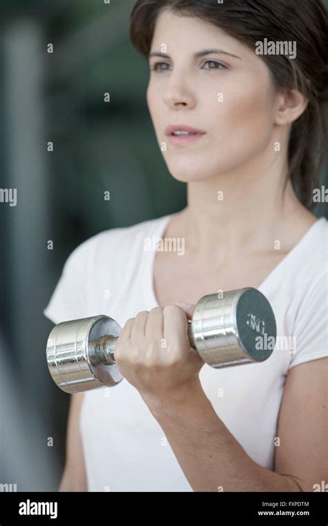 Woman Lifting Dumbbell Stock Photo Alamy