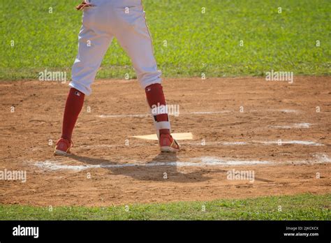 a view of a baseball player's legs Stock Photo - Alamy