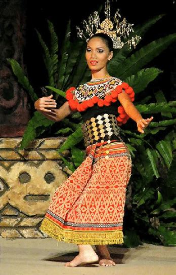 Iban lady presented Ngajat dance with traditional costume (source ...