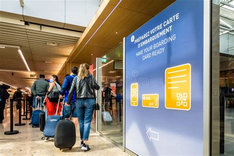 Passengers Standing In Line At A Checkpoint In The Airport Editorial