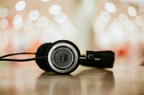 Gray And Black Headphones On Top Of Brown Surface Free Image Peakpx