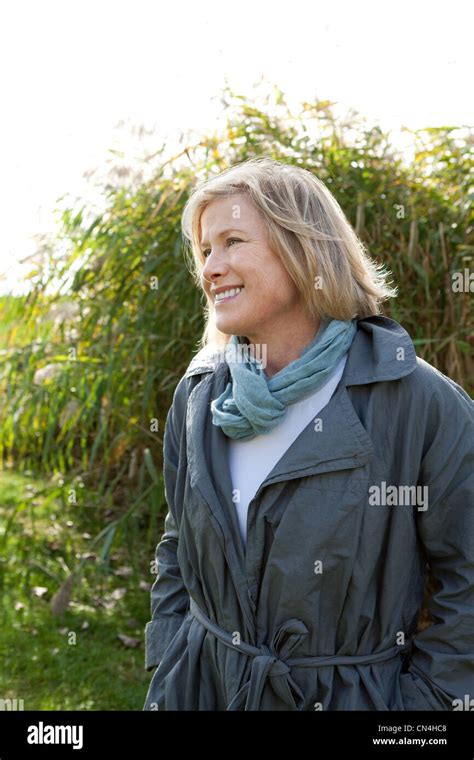 Smiling woman outdoors Stock Photo - Alamy