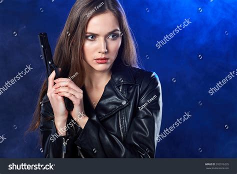 Стоковая фотография 392016235 Beautiful Sexy Girl Holding Gun Smoke