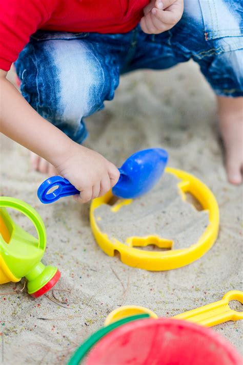 "Child Playing Sand With Toy Tools At Beach" by Stocksy Contributor ...