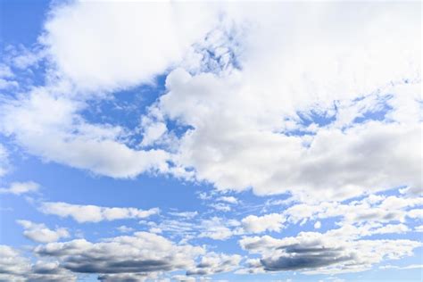 Premium Photo White Clouds In A Bright Blue Sky The Beauty Of The Nature