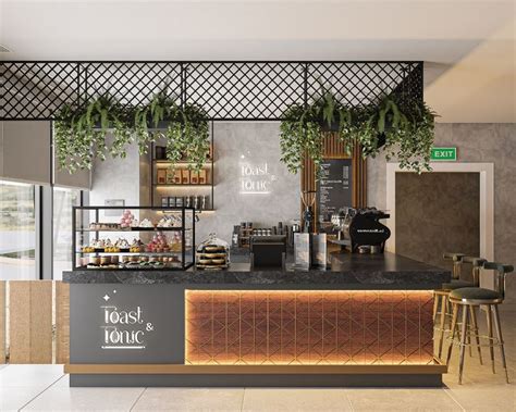 A Coffee Shop With Plants Hanging From The Ceiling And An Open Counter