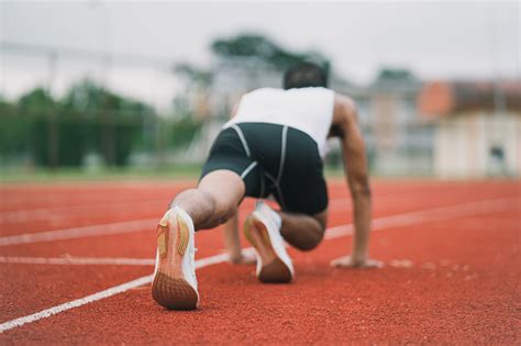 Athletes Sport Man Runner Wearing White Sportswear To Stretching And