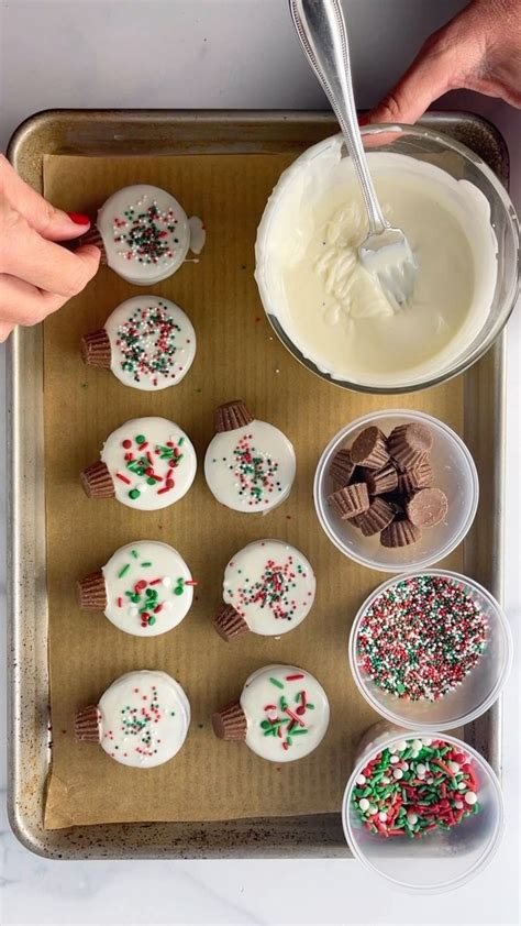 Cupcakes With White Frosting And Sprinkles On A Tray