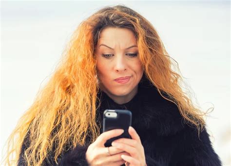 Upset Sad Skeptical Unhappy Woman Texting On Mobile Phone Stock Image