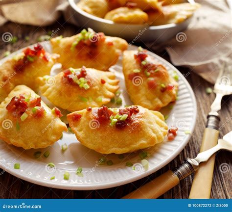 Baked Dumplings Stuffed With Curd Cheese And Potatoes On A White Plate Traditional Polish Dish