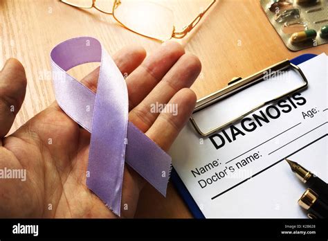 Symbol of cancer. Lavender awareness ribbon Stock Photo - Alamy