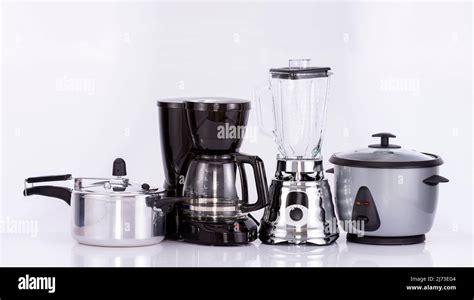 Modern small kitchen appliances on neutral background Stock Photo - Alamy