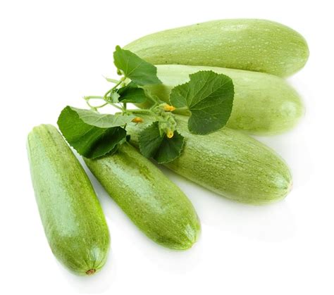 Premium Photo Raw Zucchini With Leaves Isolated On White