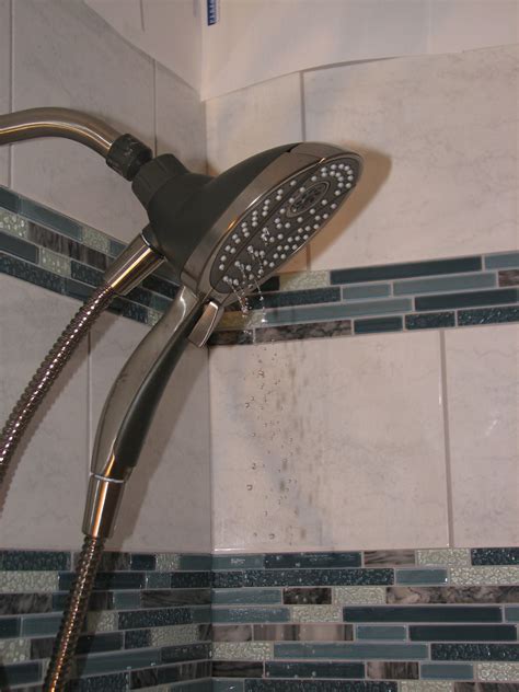 plumbing - Why does my shower head drip when the tub faucet is on