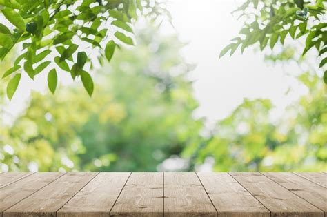 Premium Photo Empty Wood Table Top And Blurred Green Tree In The Park